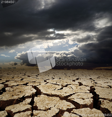 Image of dramatic sky and drought earth