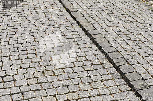 Image of cobbled road as background