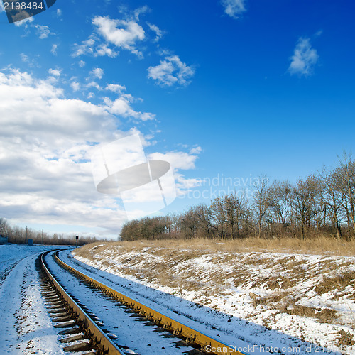 Image of railroad to sunset. winter time