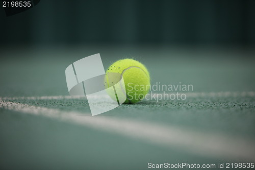 Image of Close up of a tennis ball in the foreground