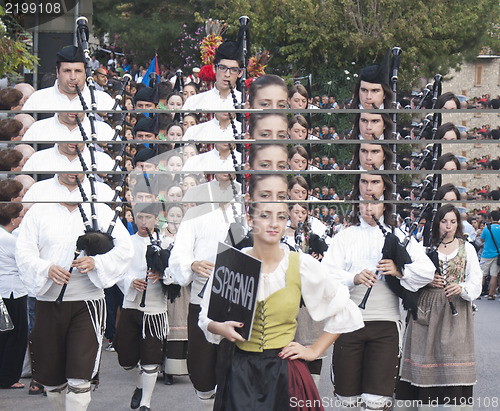 Image of Spanish folk musicians group playing bagpipes