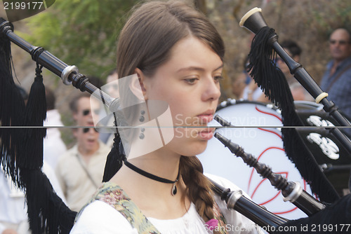 Image of Spanish folk musicians group playing bagpipes