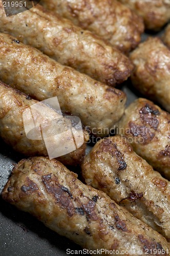 Image of cooking sausages in a pan