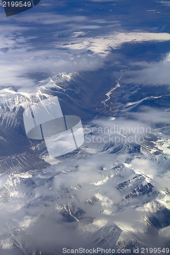 Image of Pattern of snow, clouds and stones: