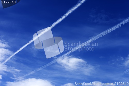 Image of Blue sky with contrails