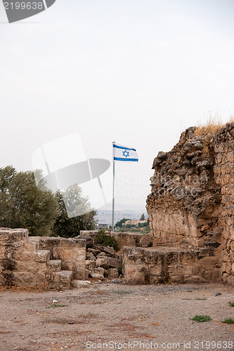 Image of Israeli flag and ruins in galilee