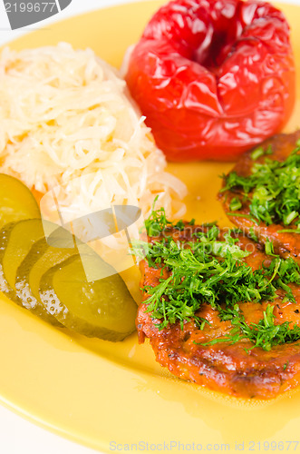 Image of Stewed meat with vegetables on a garnish