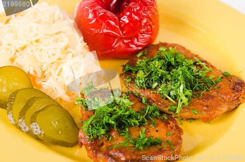 Image of Stewed meat with vegetables on a garnish