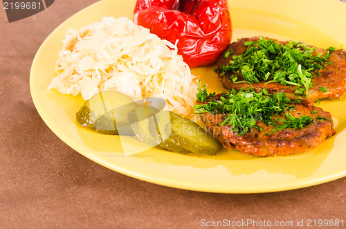 Image of Stewed meat with vegetables on a garnish