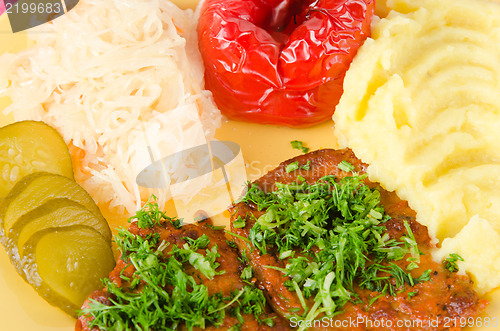 Image of Stewed meat with vegetables on a garnish