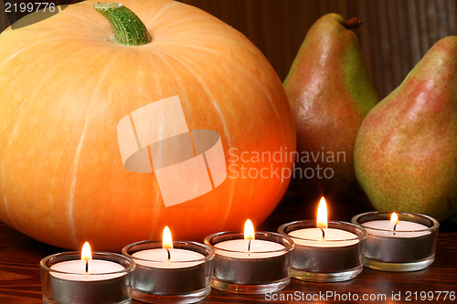 Image of Cucurbit and pears in fire light