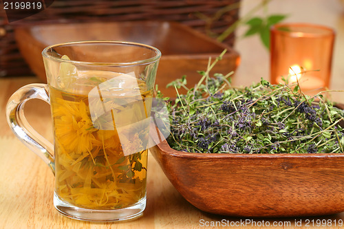 Image of Herbs in glass and bowl