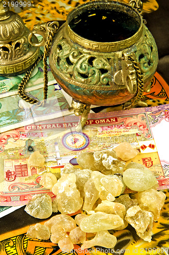 Image of Olibanum with banknotes of Oman