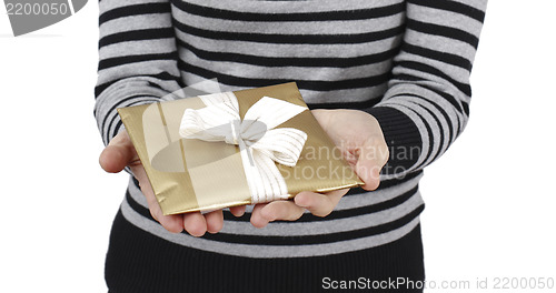 Image of Young woman holding a present
