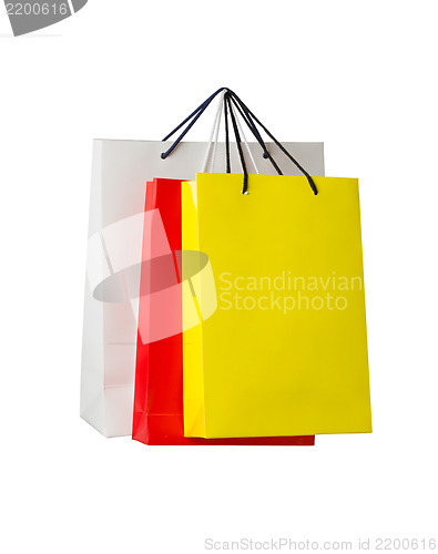 Image of Assorted colored shopping bags on white background