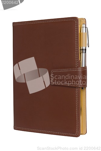 Image of Leather notebook and pencil on white background.