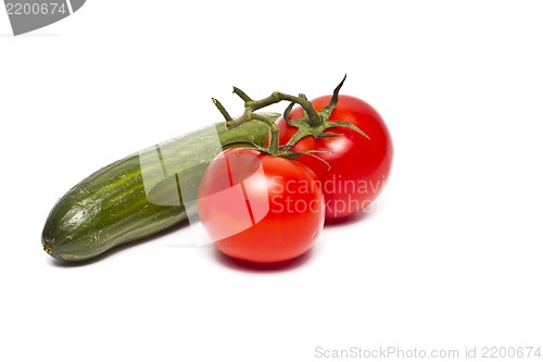 Image of tomato and green cucumber isolated on a white background