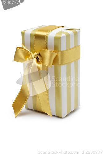 Image of Gift box in gold duo tone with golden satin ribbon and bow isolated over white background.