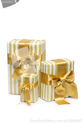 Image of Gold gift boxes isolated on white background