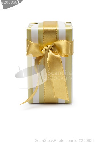 Image of Gift box in gold duo tone with golden satin ribbon and bow isolated over white background.