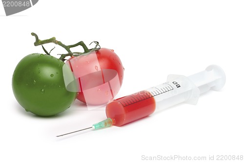 Image of syringe and green with red tomatoes