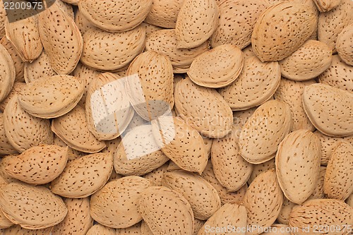 Image of Pile of almonds close-up as background.