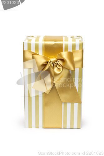 Image of Gift box in gold duo tone with golden satin ribbon and bow isolated over white background.