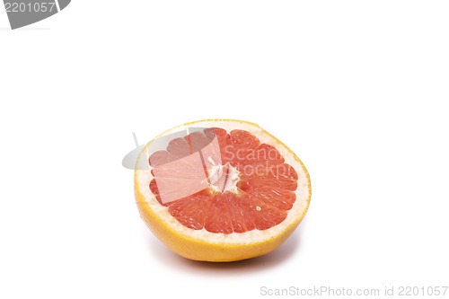Image of slice of grapefruit isolated on white background