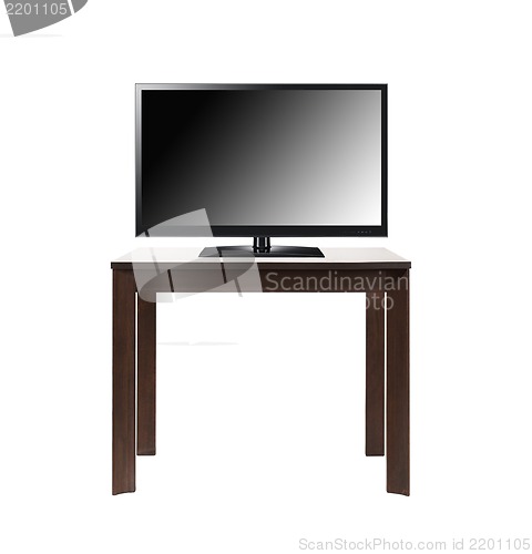 Image of black tv screen on brown table