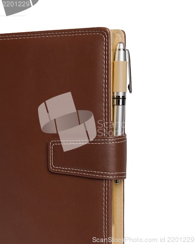 Image of Leather notebook and pencil on white background.