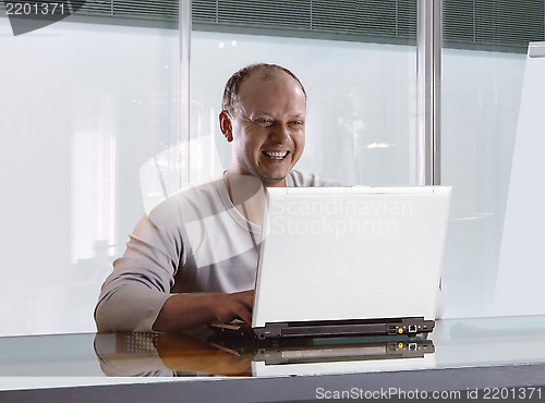 Image of businessman in the modern office