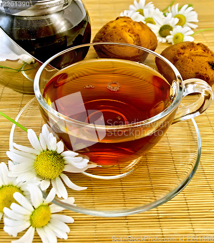 Image of Herbal tea with daisies and kettle