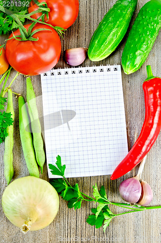 Image of Notebook with vegetables and parsley