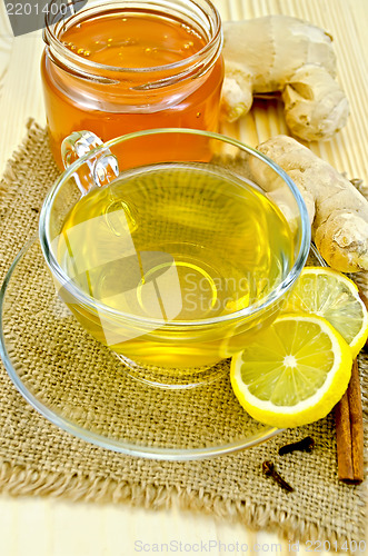 Image of Tea ginger on a napkin of burlap with honey