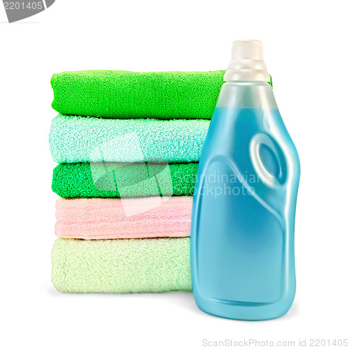 Image of Fabric softener the bottle and a stack of towels