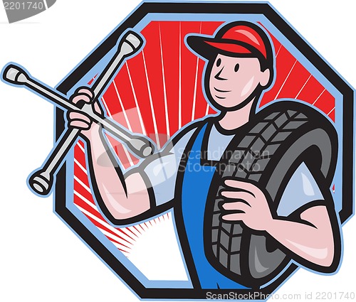 Image of Mechanic With Tire Socket Wrench And Tire