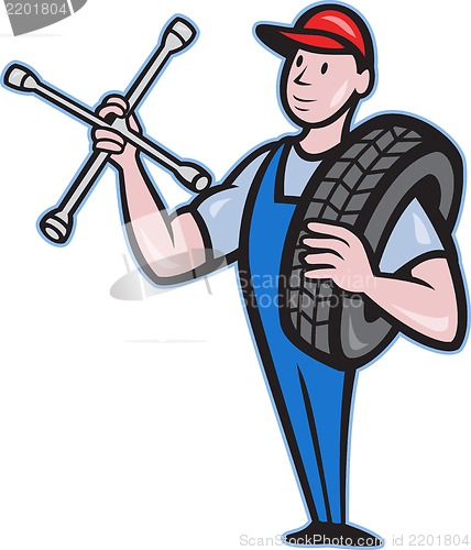 Image of Mechanic With Tire Socket Wrench And Tire