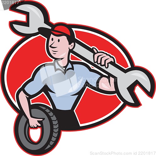 Image of Mechanic With Spanner And Tire Wheel