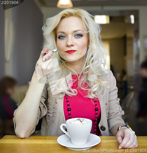 Image of blonde and white cup of coffee