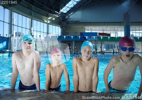 Image of happy children group  at swimming pool