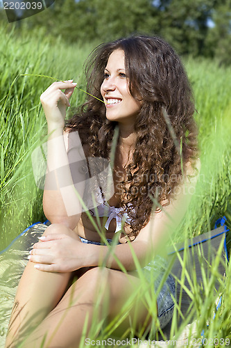 Image of woman in green grass