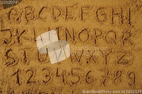 Image of alphabet  in the sand