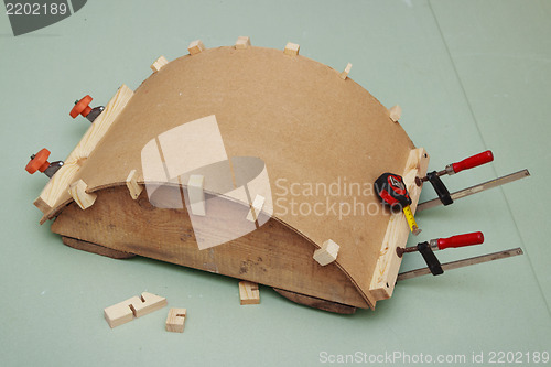 Image of Gluing the arch of hardboard  on  rule