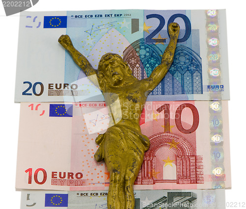 Image of concept gold jesus crucify euro cash banknotes 