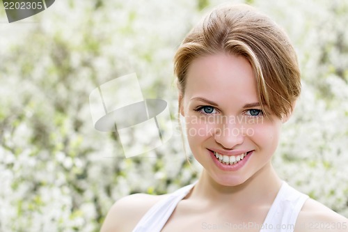 Image of Smiling young blond woman