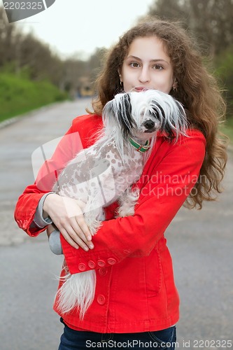 Image of Girl holding little dog