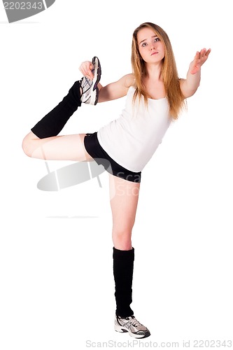 Image of fitness woman making balance exercise