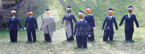 Image of Pumpkin people - businessmen in suits