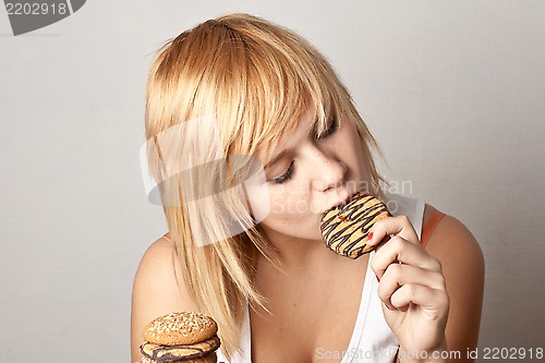 Image of woman eating cookies