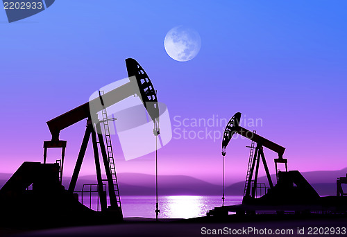 Image of oil pumps at night